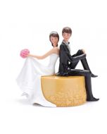 Figurine couple mariés sur pouf 