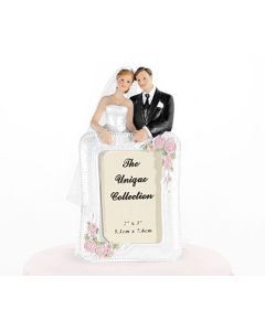 Couple de mariés avec cadre photo